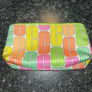 green colorful Clinique makeup bag